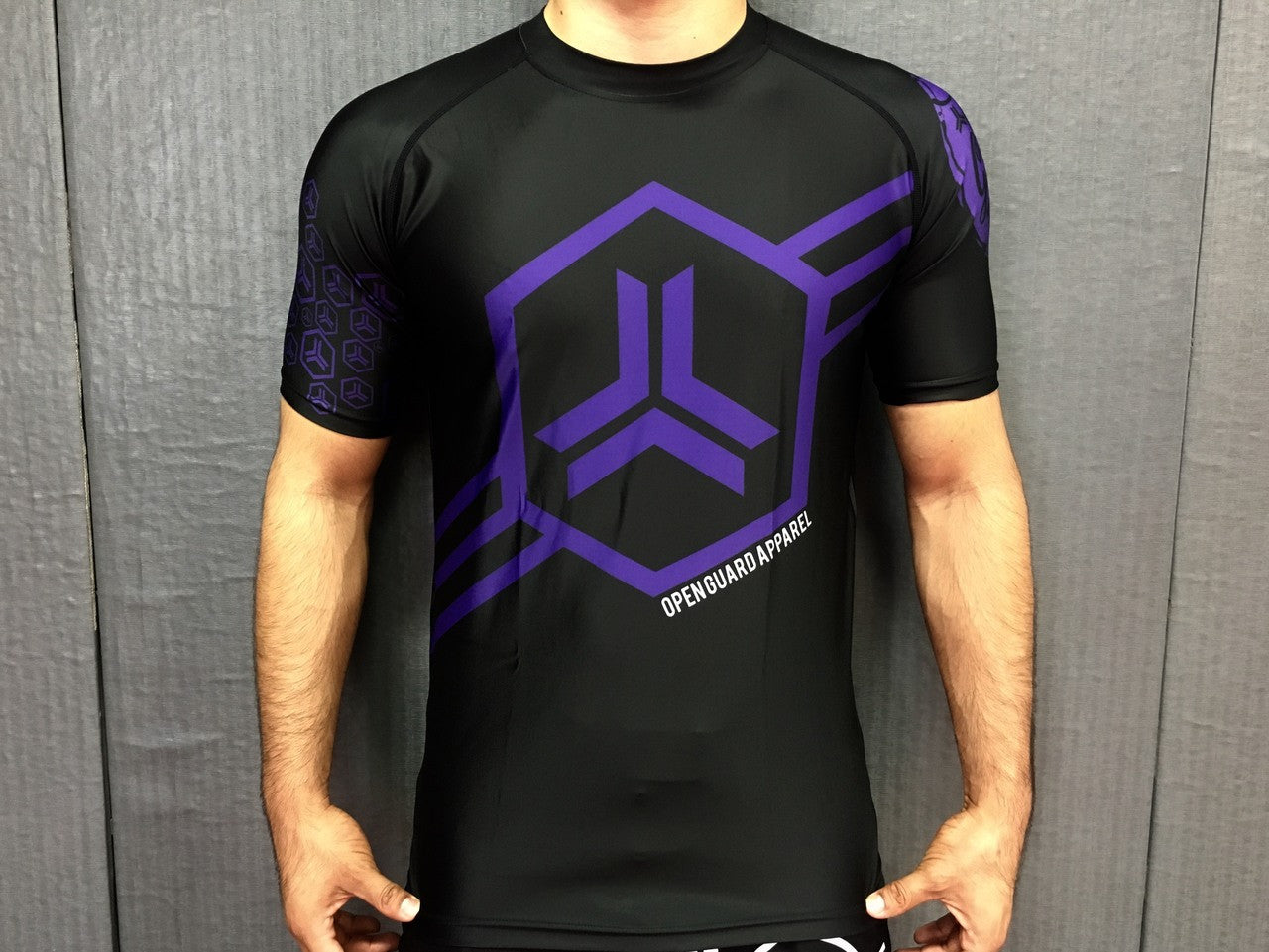 Open Guard Apparel Hex Flow Ranked Short Sleeve Rashguard available at www.openguardapparel.com Purple Belt design
Enjoy Quick shipping anywhere from Open Guard Apparel today!