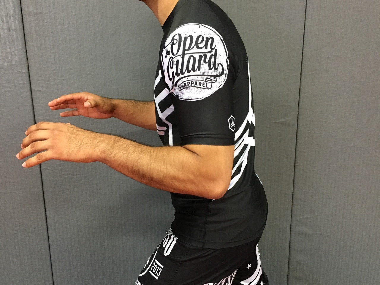 Side view of the white belt ranked rashguard Open Guard Apparel Hex Flow Ranked Short Sleeve Rashguard available at www.openguardapparel.com
Enjoy Quick shipping anywhere from Open Guard Apparel today!