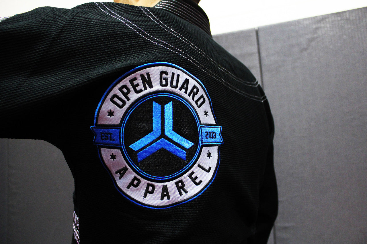 Open Guard Apparel Black Blizzard Gi now available in www.openguardapparel.com Teal accents across the gi ready for the mats.
Back embroidered patch