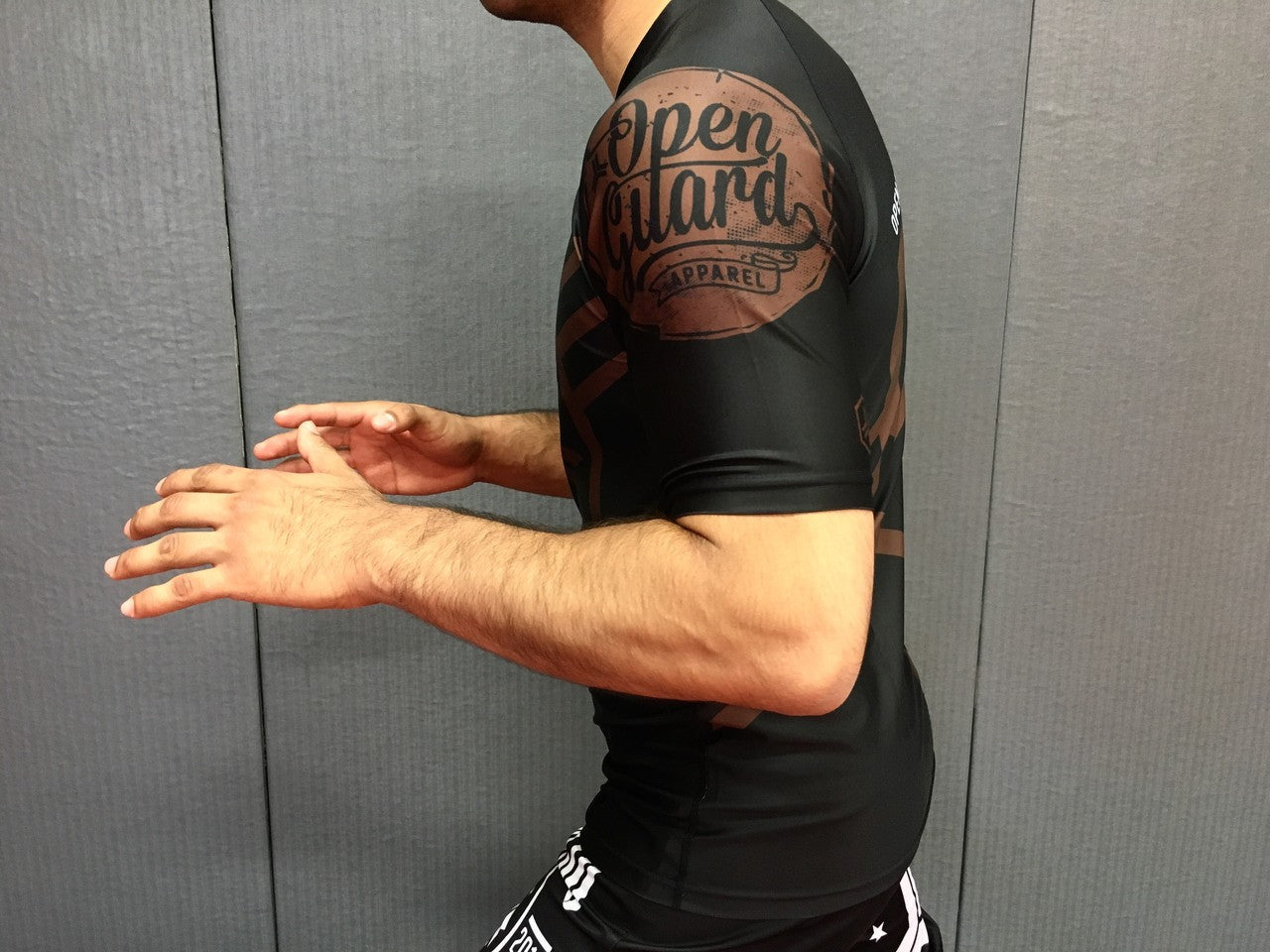 Side view of the Open Guard Apparel Hex Flow Ranked Short Sleeve Rashguard available at www.openguardapparel.com Brown Belt design
Enjoy Quick shipping anywhere from Open Guard Apparel today!