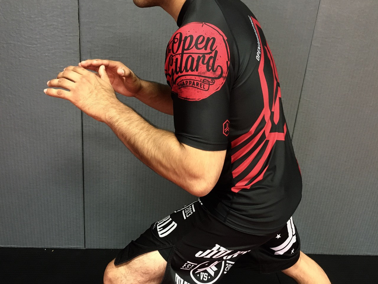 Side view of the New Open Guard Apparel Hex Flow Ranked Short Sleeve Rashguard for black belts available at www.openguardapparel.com or for the rest of us.
Enjoy Quick shipping anywhere from Open Guard Apparel today!