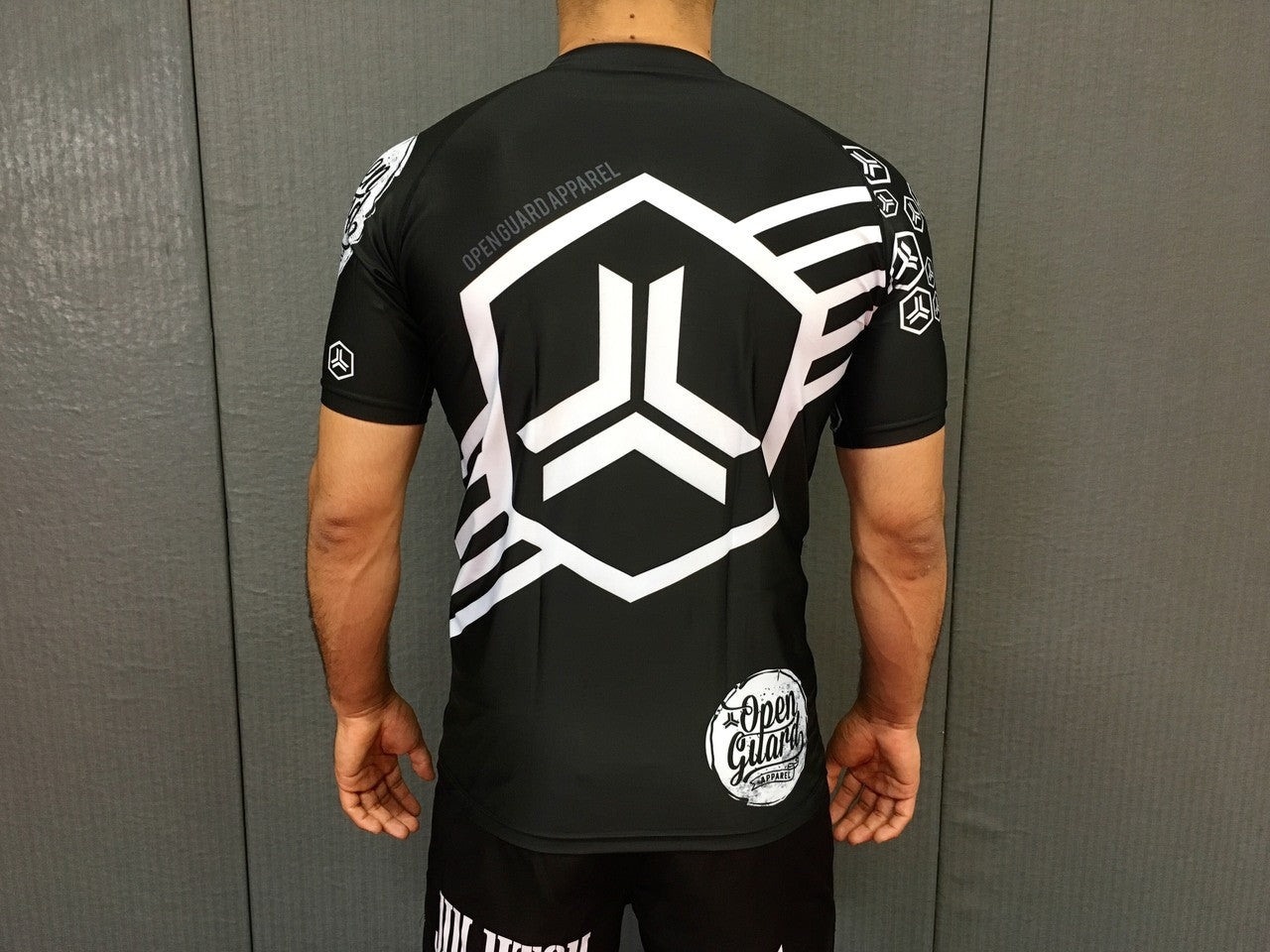 Back view of the white ranked rashguard Open Guard Apparel Hex Flow Ranked Short Sleeve Rashguard available at www.openguardapparel.com
Enjoy Quick shipping anywhere from Open Guard Apparel today!