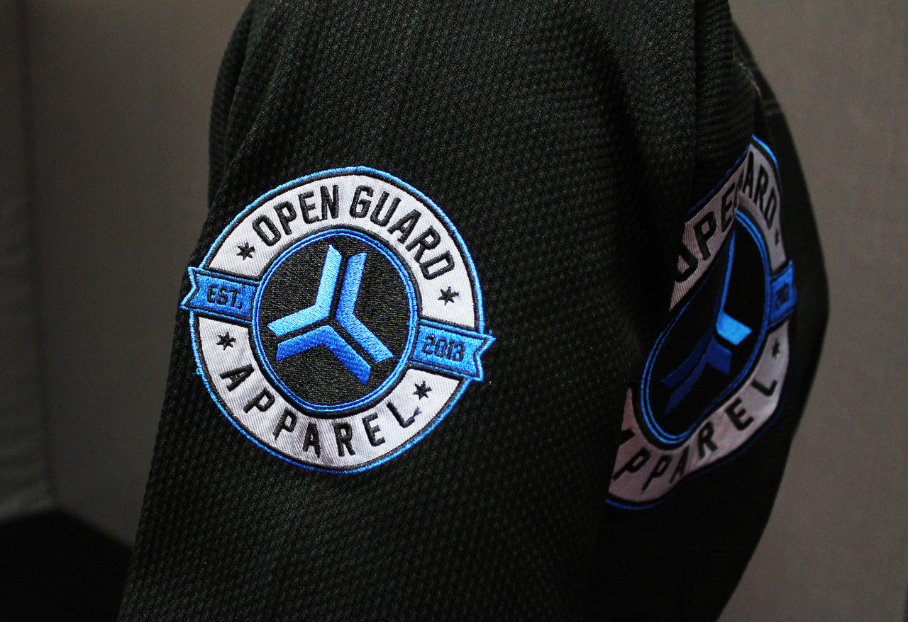 Open Guard Apparel Black Blizzard Gi now available in www.openguardapparel.com Teal accents across the gi ready for the mats.