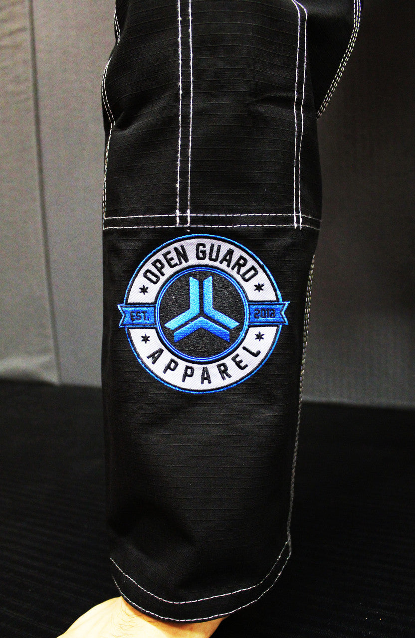 Open Guard Apparel Black Blizzard Gi now available in www.openguardapparel.com Teal accents across the gi ready for the mats.
Embroidered on the pants