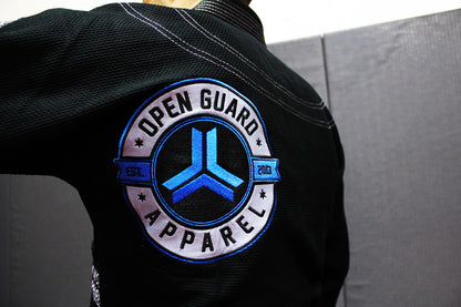 Open Guard Apparel Black Blizzard Gi now available in www.openguardapparel.com  Teal accents across the gi ready for the mats. 

Back embroidered patch