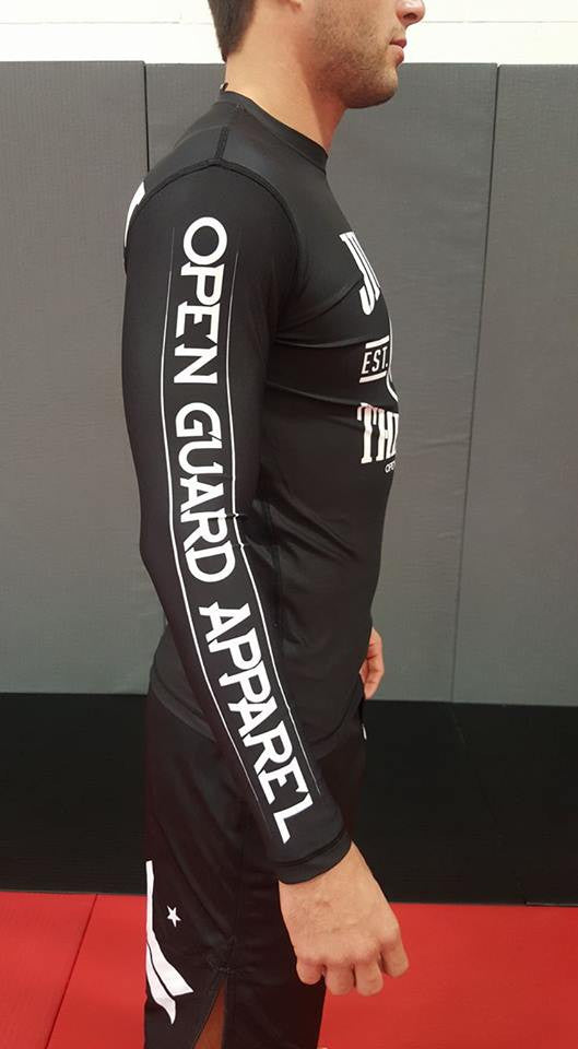 Side view of the Jiu Jitsu Vs the world rashgaurd in black.