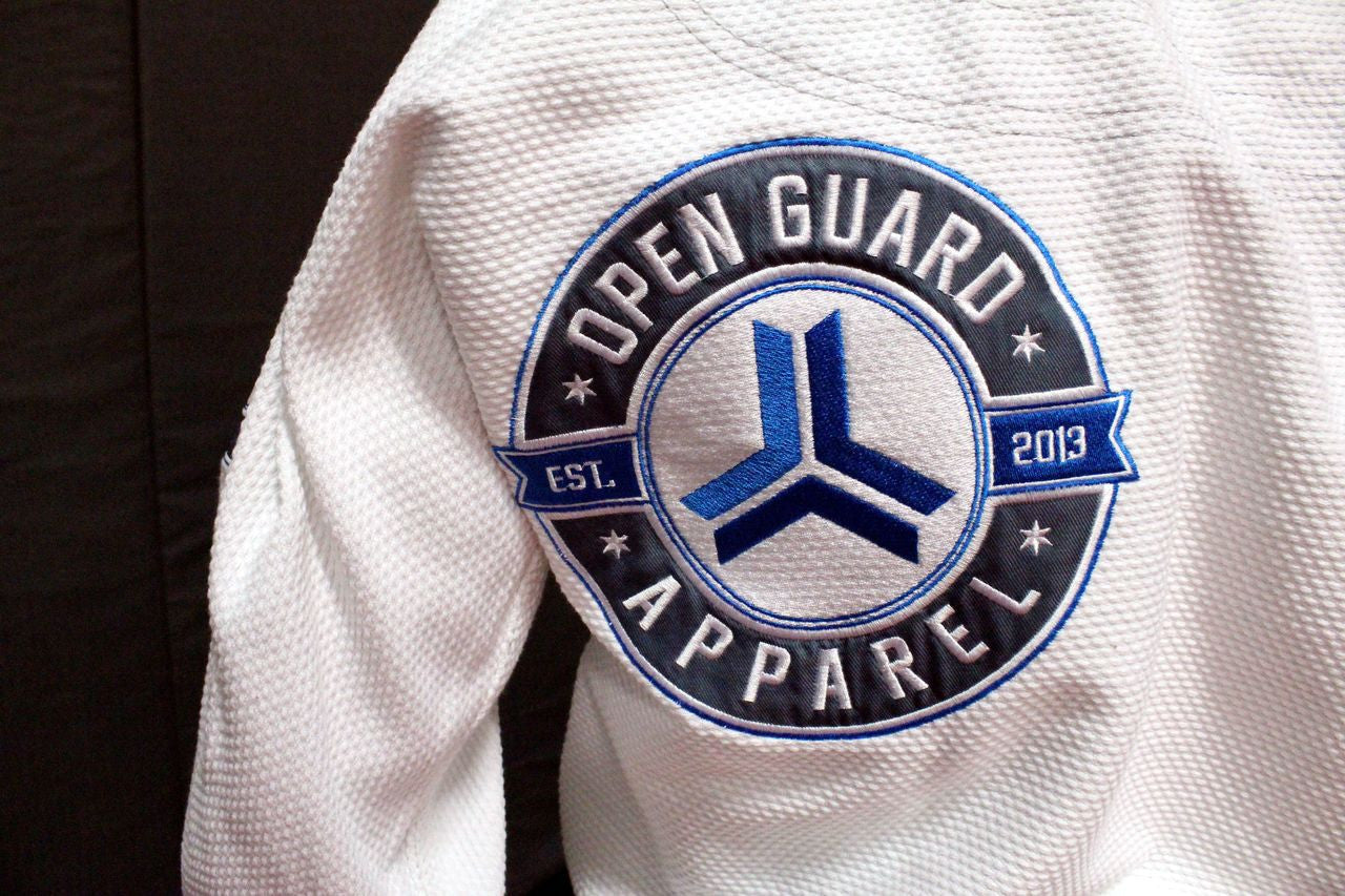 Open Guard Apparel White Blizzard Gi now available in www.openguardapparel.com  Teal accents across the gi ready for the mats. 