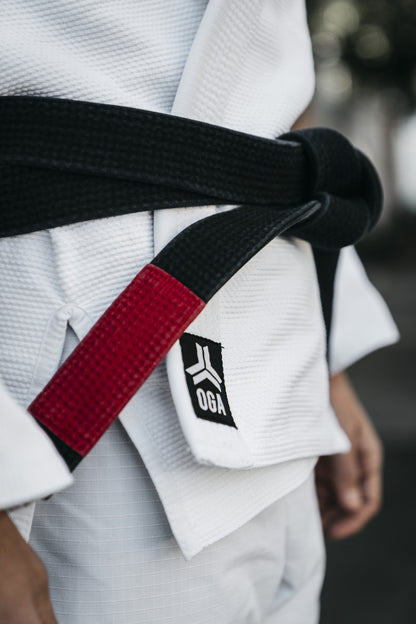 Open Guard Apparel Hex Classic Gi.  Black belt on the hex classic gi in white.  Join the team today