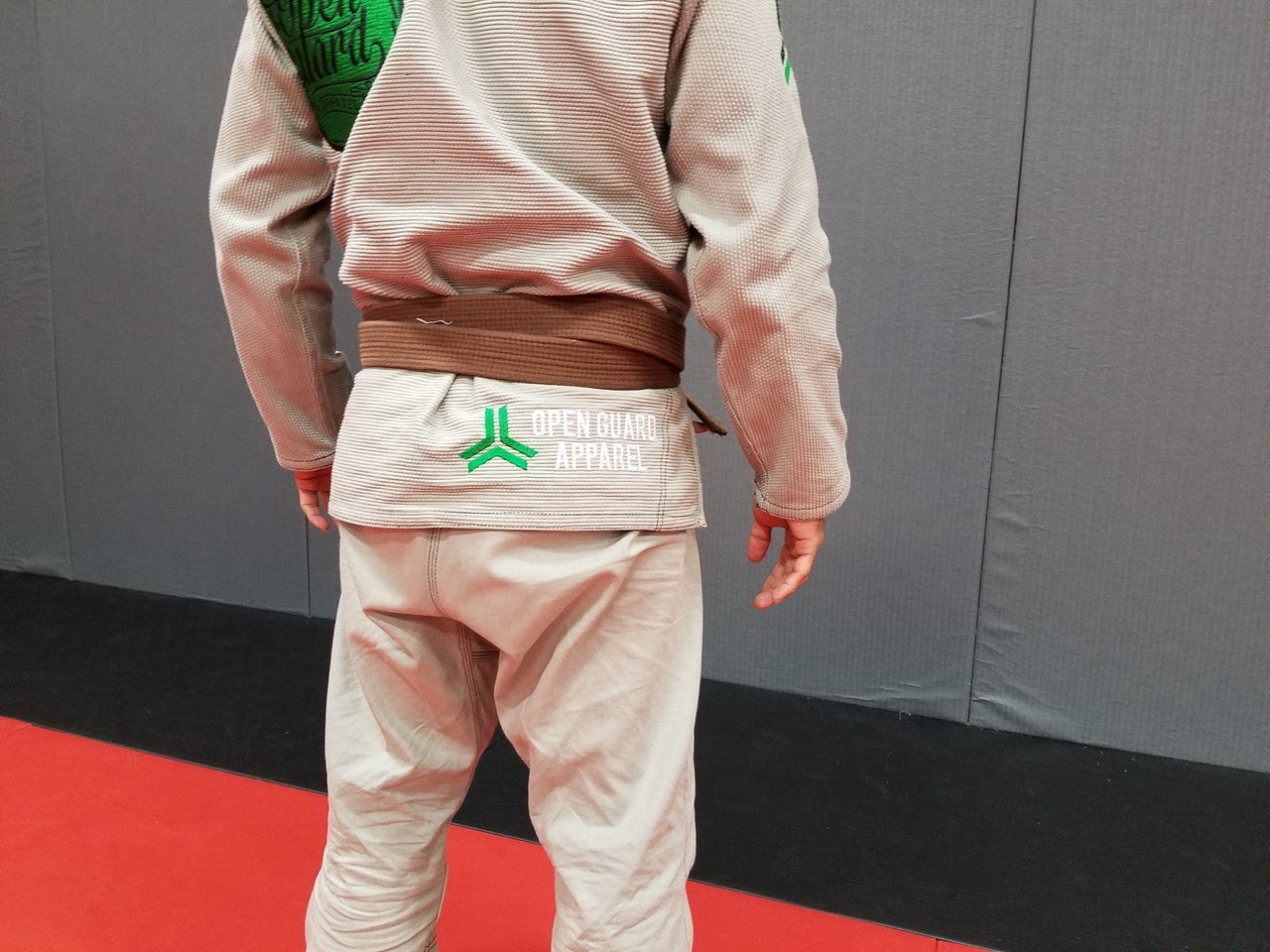 Back view of the Open Guard Apparel Circle Flow Gi in Tactical Sand & Emerald. 