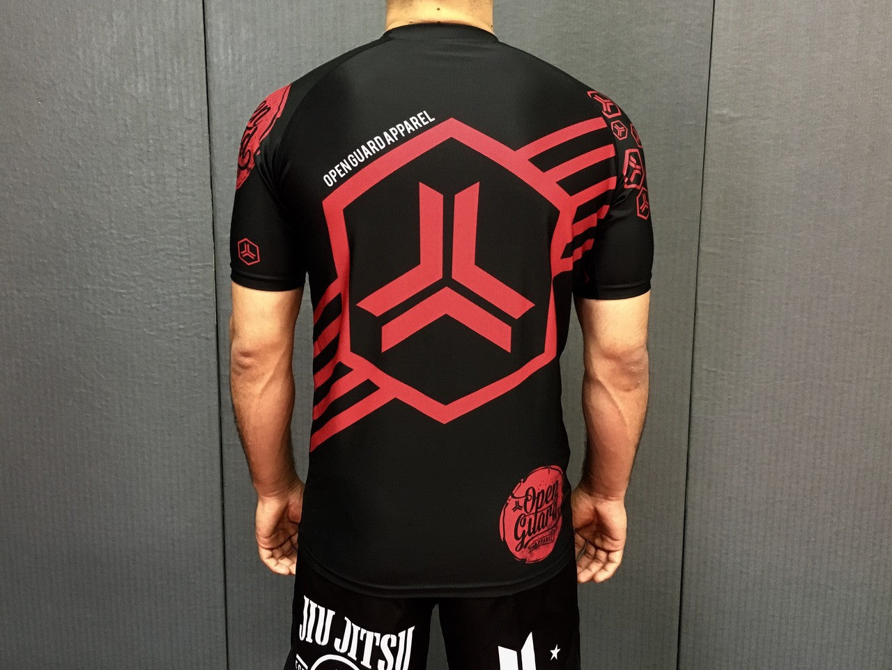 Back view of the New Open Guard Apparel Hex Flow Ranked Short Sleeve Rashguard for black belts available at www.openguardapparel.com or for the rest of us.

Enjoy Quick shipping anywhere from Open Guard Apparel today!