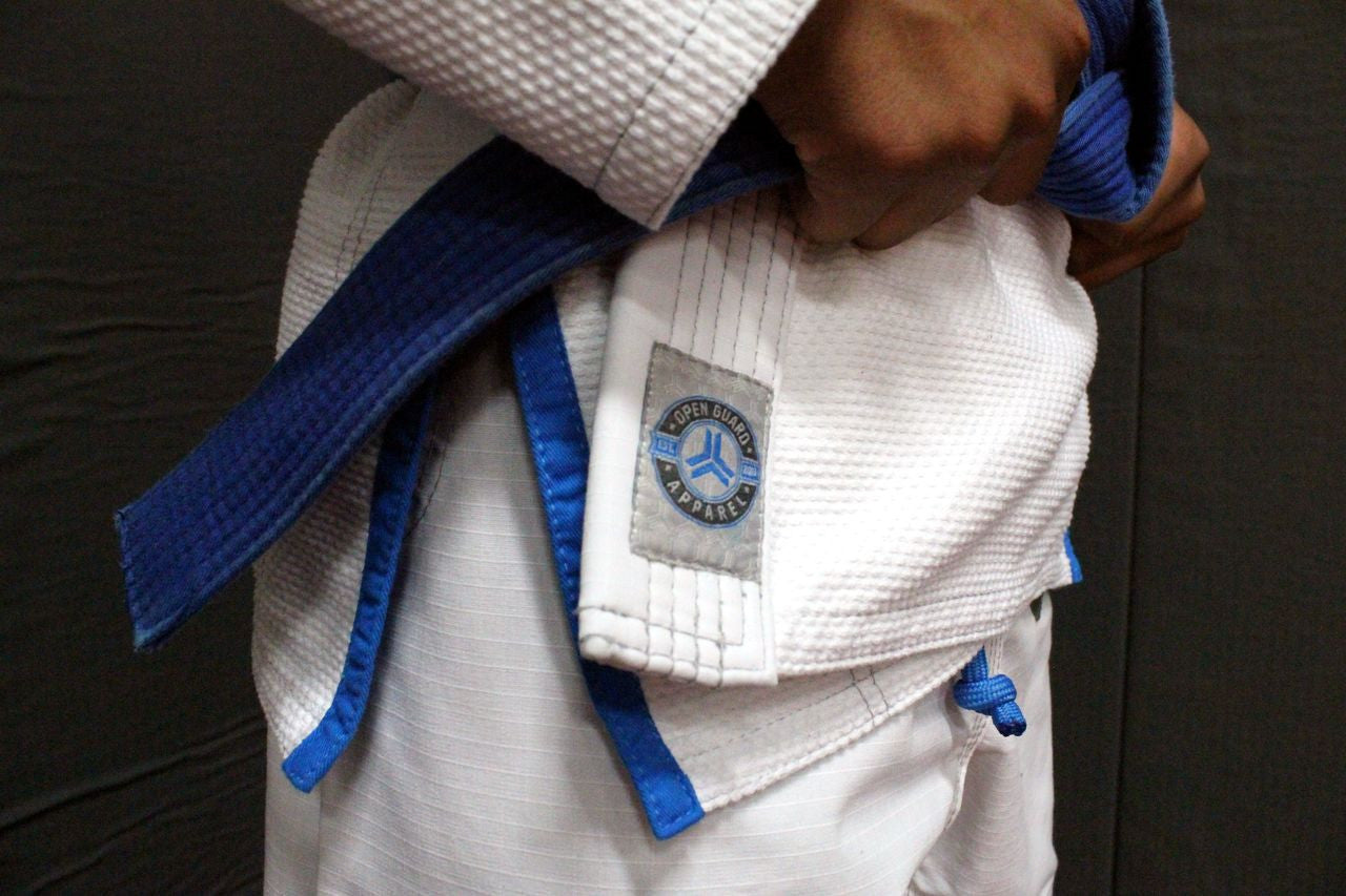 Open Guard Apparel White Blizzard Gi now available in www.openguardapparel.com  Teal accents across the gi ready for the mats. 