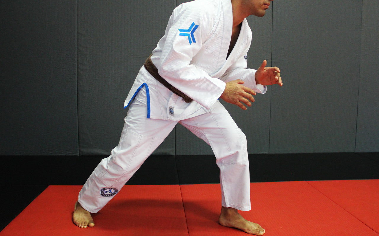 Open Guard Apparel White Blizzard Gi now available in www.openguardapparel.com  Teal accents across the gi ready for the mats. 