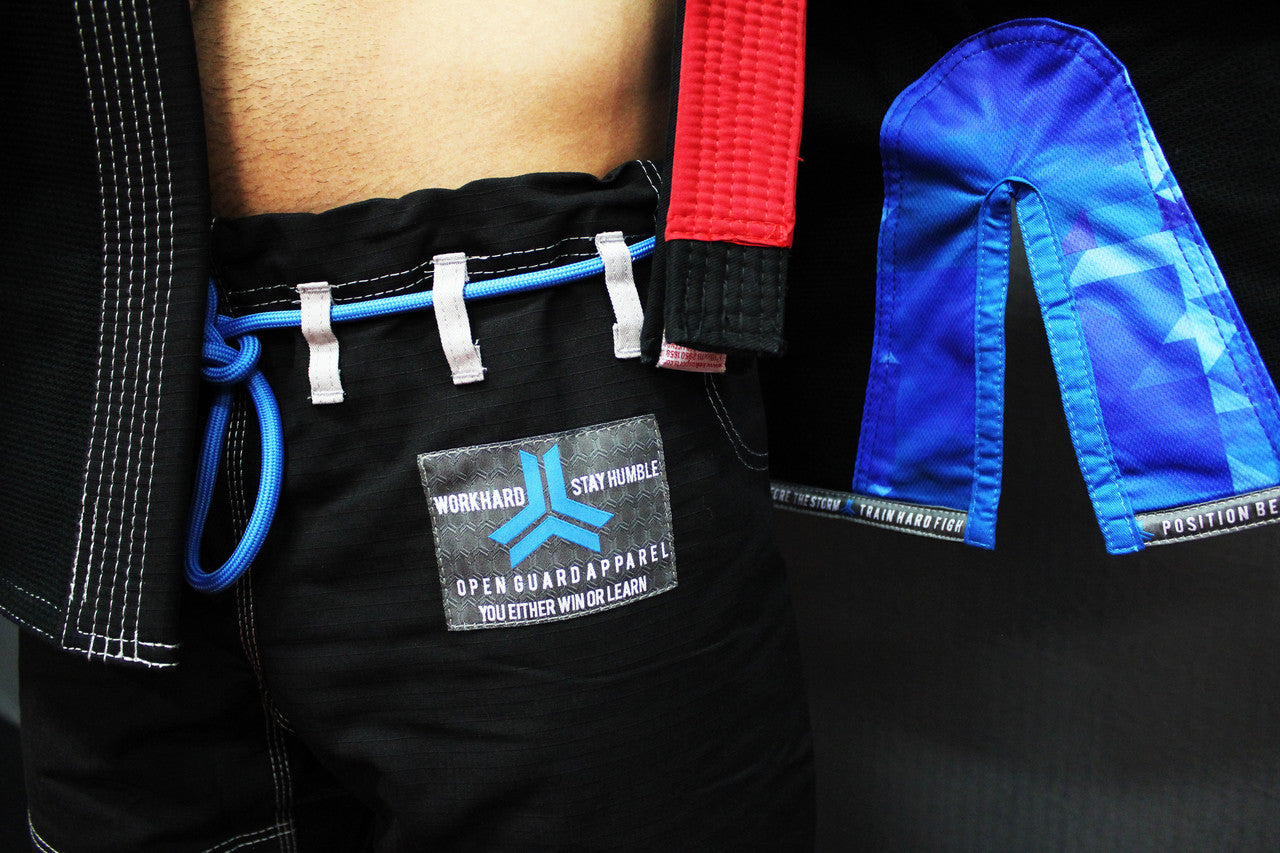 Open Guard Apparel Black Blizzard Gi now available in www.openguardapparel.com  Teal accents across the gi ready for the mats. 