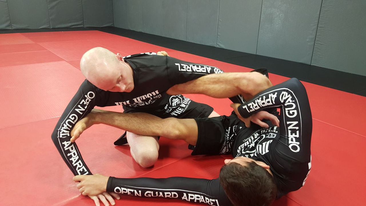 Jiu Jitsu Vs the world rashgaurd in black.