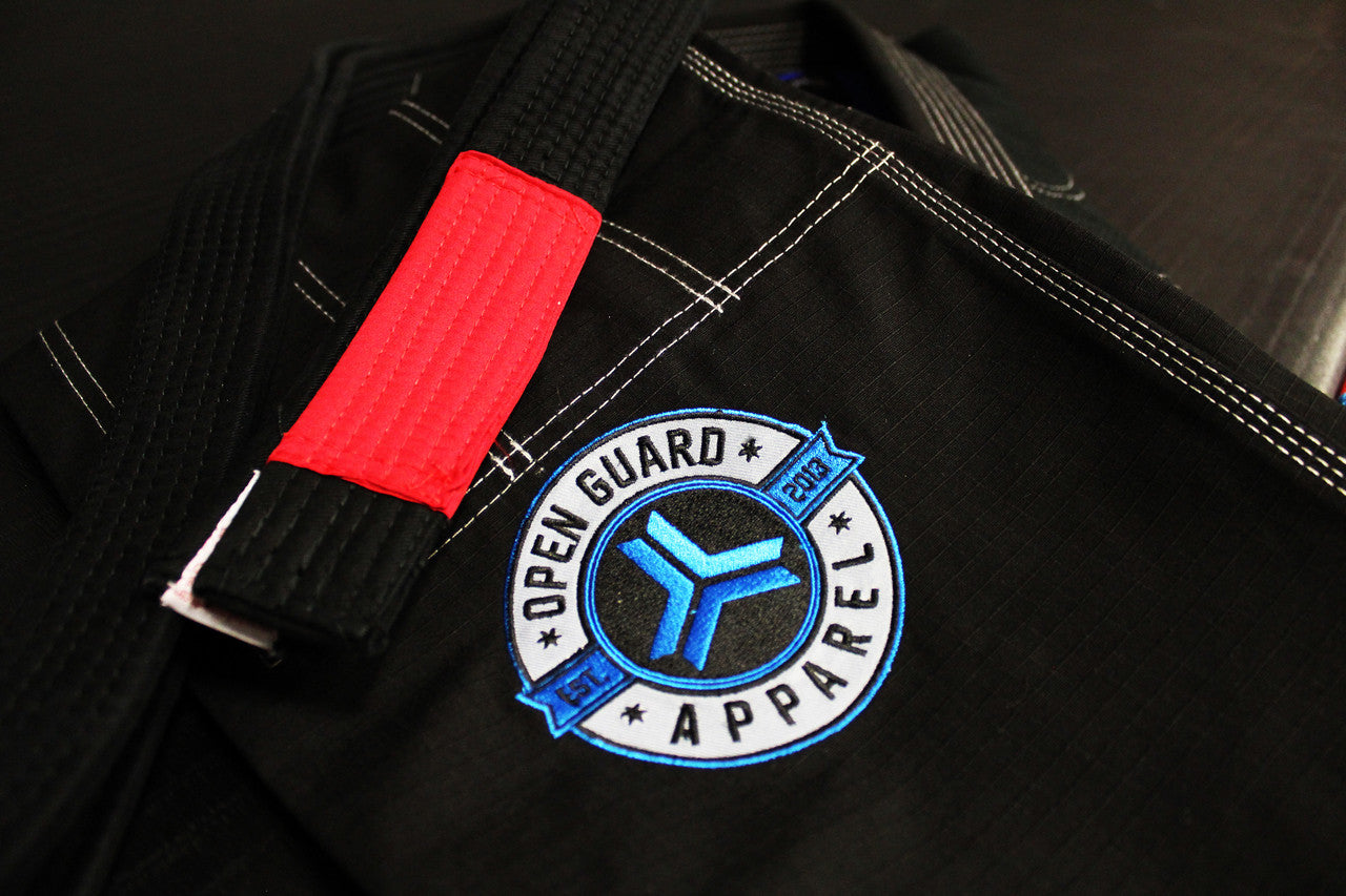 zoom in of the Open Guard Apparel Black Blizzard Gi now available in www.openguardapparel.com  Teal accents across the gi ready for the mats. 