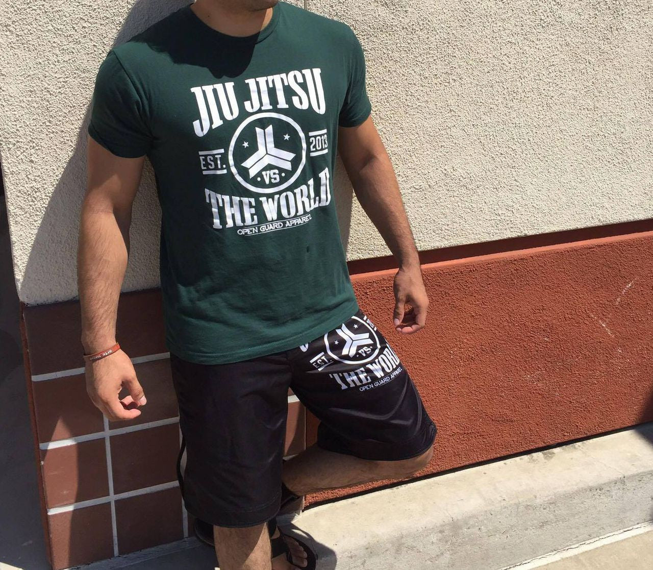 Model of the OGA Jiu-jitsu vs the world tshirt in green.